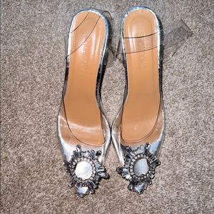 Clear Cinderella Heels with ankle strap.